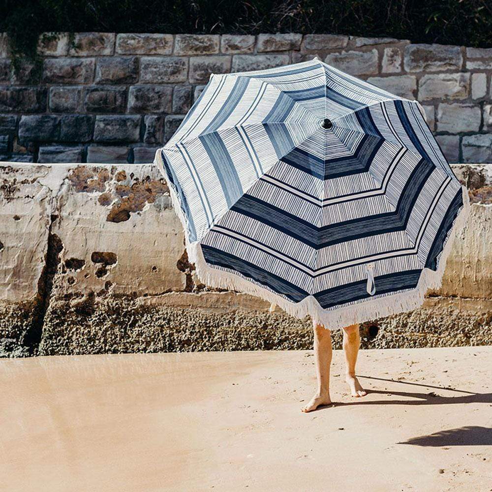 Protect yourself from the sun in style with the Premium Beach Umbrella by Basil Bangs.